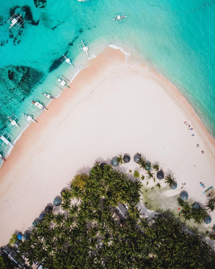 Aerial view of Daku Island beachfront in Siargao