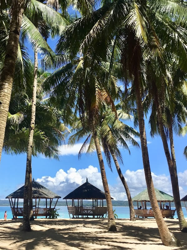 Cottages lining up on the coast of Daku Island Siargao